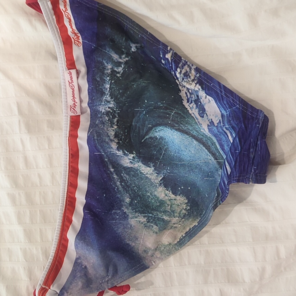 Bikini bottom with ocean-wave print and red ties